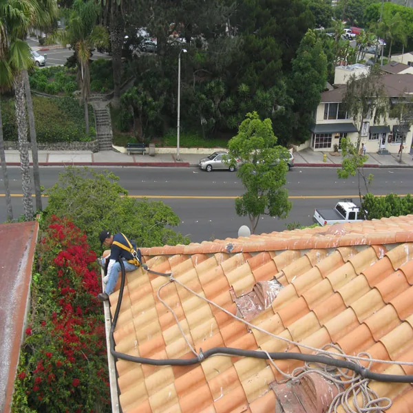 Roof edge and nearby street view used to illustrate dense-site access planning.